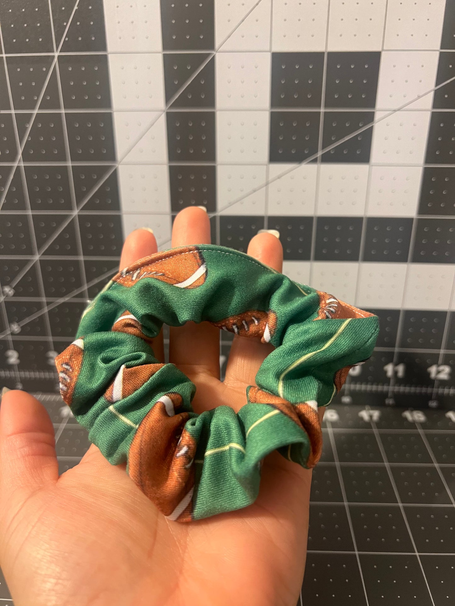 One standard size scrunchy: classic football